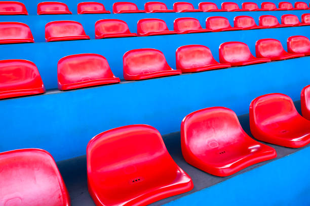 istock Amphitheater of Red seats abstract background 825799796