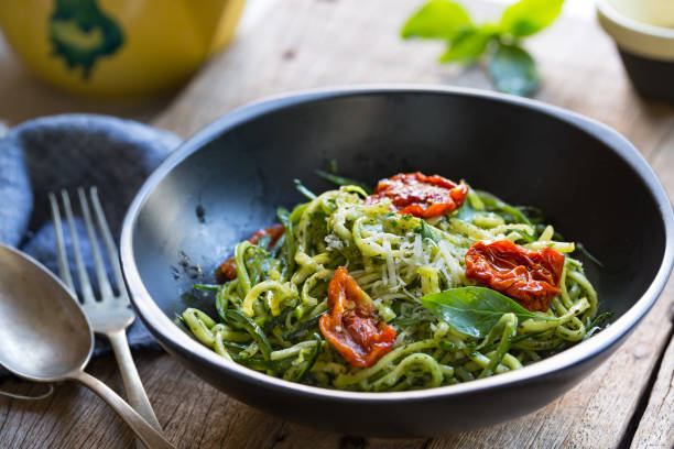 istock Zucchini Pasta in Pesto sauce with Sun dried Tomato 825799842