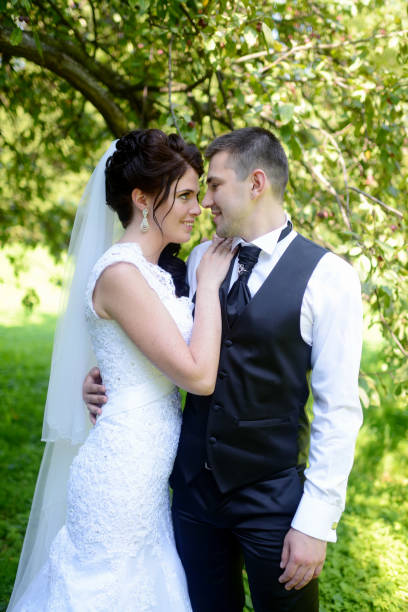 istock Wedding couple on the nature is hugging each other 825800082