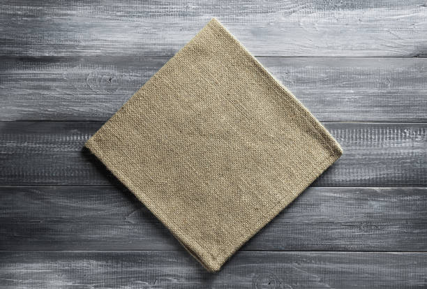 istock cloth napkin checked on wood 825802628