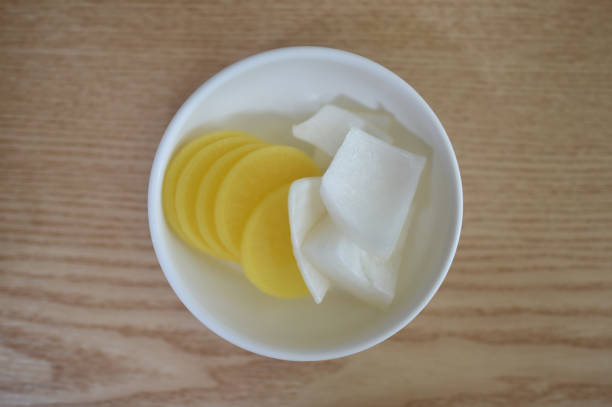 istock Onion and pickled radishes in the dish 825802822