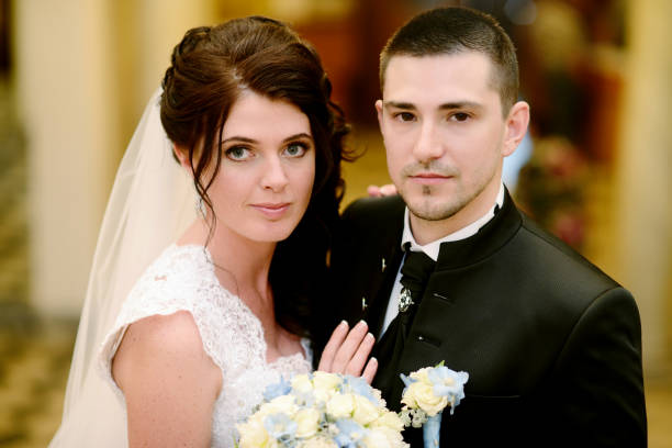 istock Wedding couple indoors is hugging each other 825802950