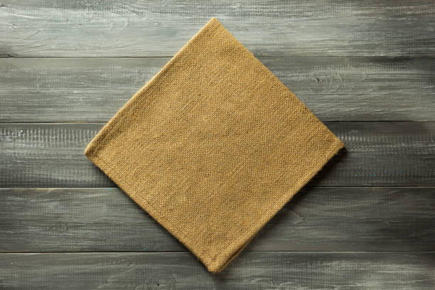 istock cloth napkin checked on wood 825803220