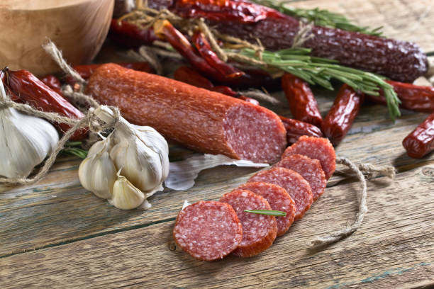 istock Sausages with rosemary , garlic and pepper. 825804798