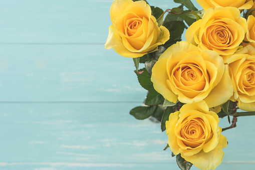 Yellow Roses Bouquet on white wood background