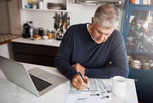 istock Working through his financial savings and investments 825810332