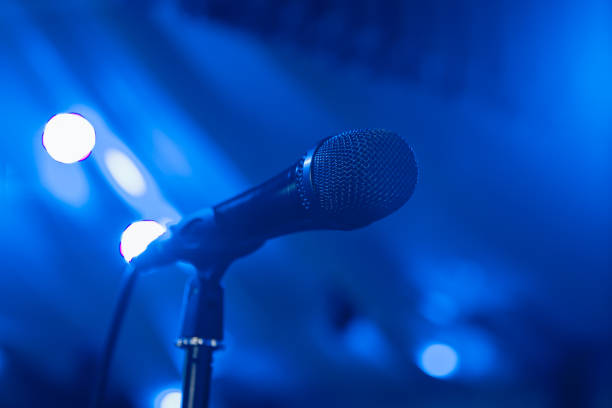 istock Microphone. Microphone on stage. Microphone close-up. A pub. Bar. A restaurant. Classical music. Music 825819088