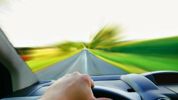 istock Driving a fast car POV 825822782