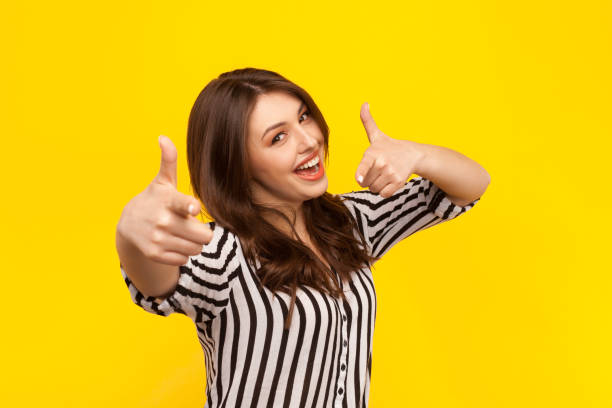 istock Cheerful model showing thumbs up 825825810