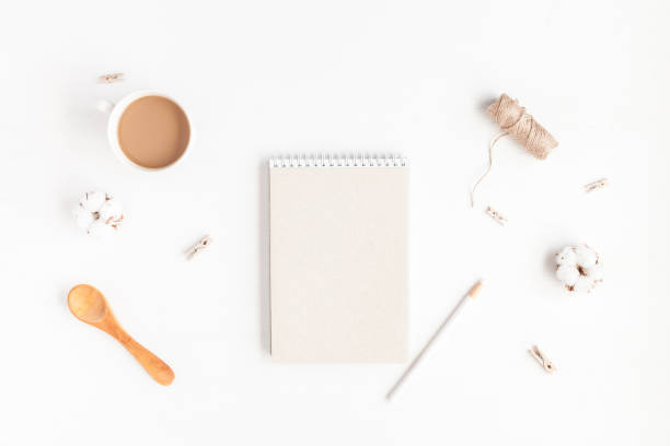 istock Notebook, cup of coffee, cotton flowers. Flat lay, top view 825825864