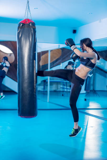 istock Female boxer in gym 825826314