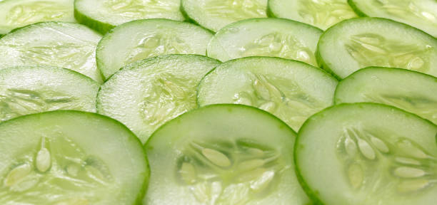 istock Cucumber slices isolated on white background 825826650