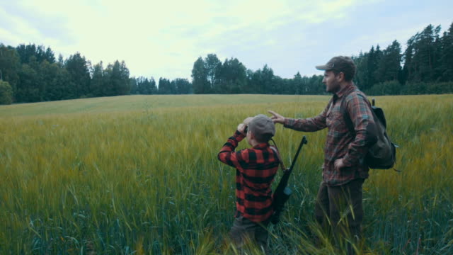 Father and Son hunting for boar (slow motion)