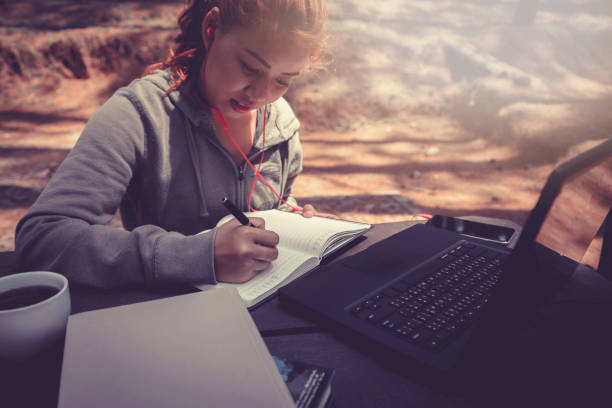 istock Woman working in a natural garden on vacation. 825827886