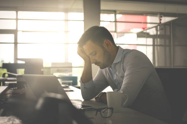 istock Business man having problem in the work. Business man sitting in office. 825828194