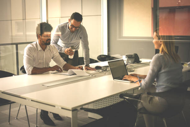 istock Business people using technology and checking document. Business people at the office. 825828482