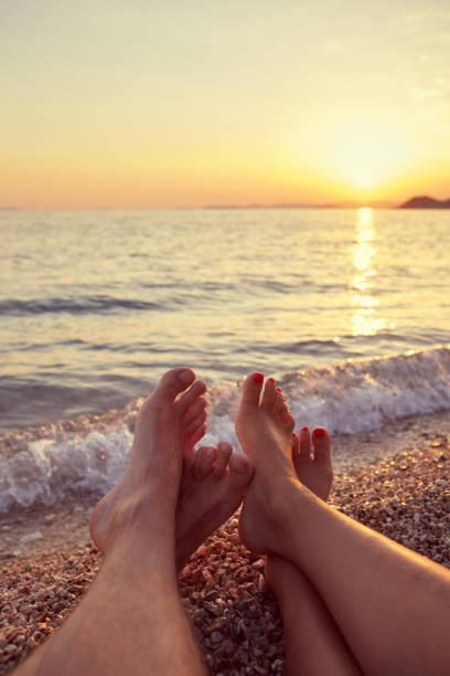 istock Couple lying on the beach 825835368