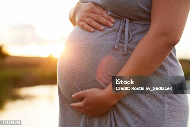 Close Up Of Pregnant Woman Stock Photo - Download Image Now - Pregnant, Human Abdomen, One Woman Only