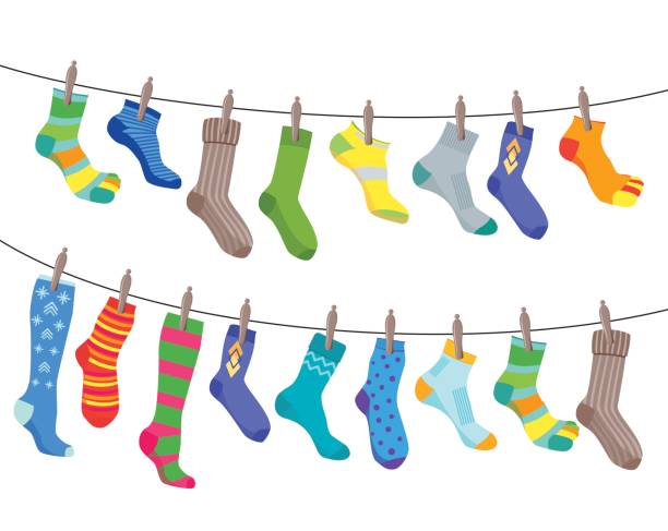 illustrations, cliparts, dessins animés et icônes de chaussettes colorées de fun set de se bloquer sur la corde. vector - multi colored variegated wool colors