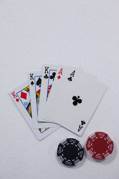 istock Playing cards and casino chips on white background 825839242