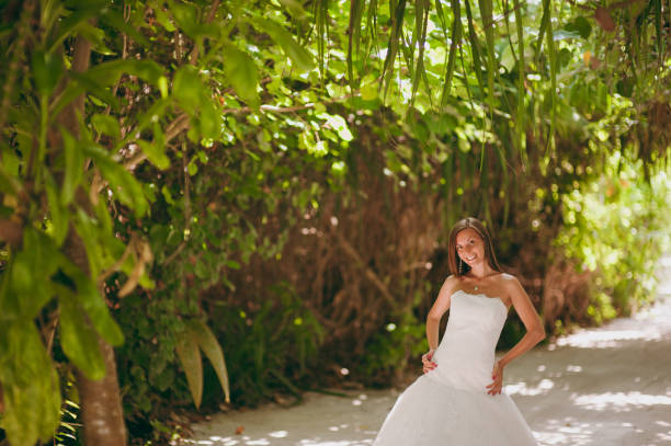 istock Beautiful bride on an island in palms 825845334