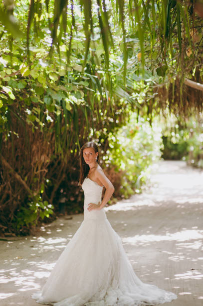 istock Beautiful bride on an island in palms 825845630