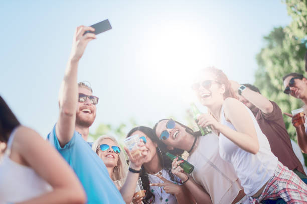 istock Friends taking self portrait at party 825846620