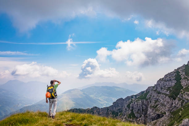 istock Hiker looking from the top of the mountain 825846778