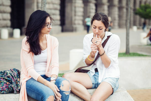 Girl lighting up a cigarette