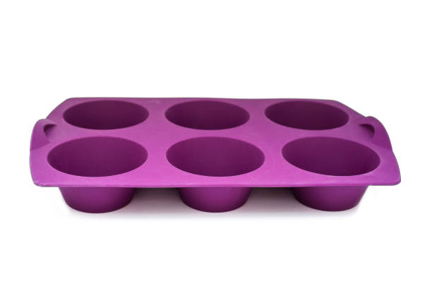 istock Bright violet silicone muffin pan isolated 825854320