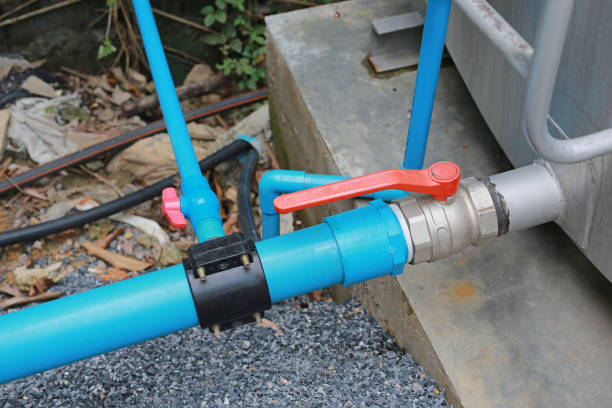 istock Water PVC pipe junction and valve from metal tank. 825854874