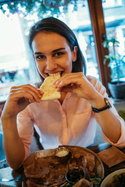 istock Woman eating at a restaurant 825855456