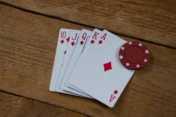 istock High angle view of cards and chip 825858718