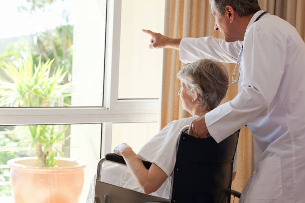 istock Doctor with his patient looking out the window 825862144
