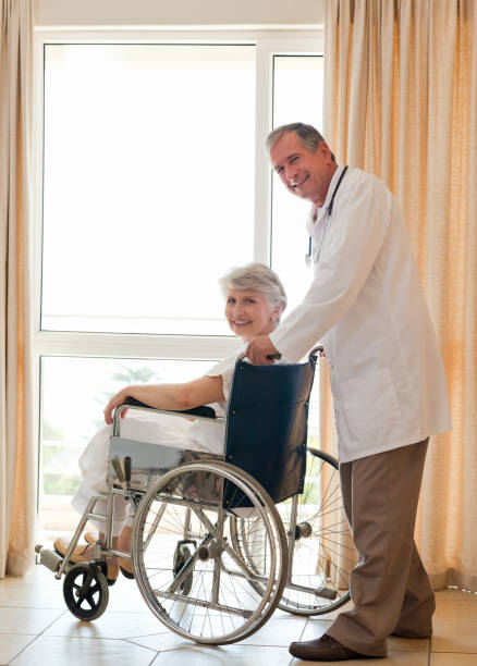 istock Doctor with his patient looking at the camera 825862674