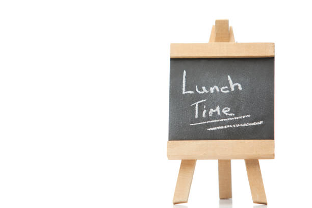 istock Chalkboard with the words lunch time written on it 825862686