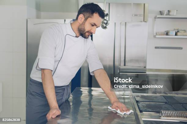 Man Japanese Restaurant Chef Working In The Kitchen Stock Photo - Download Image Now