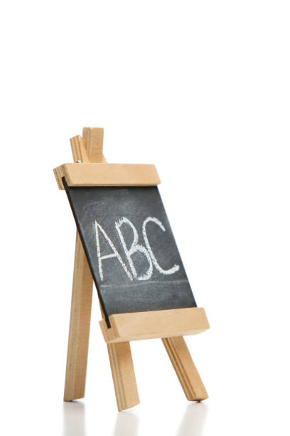 istock Angled chalkboard with the letters abc written on it 825863302
