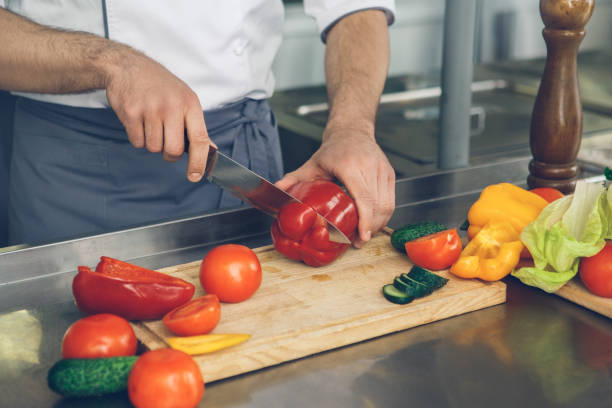 istock Man japanese restaurant chef cooking in the kitchen 825865554