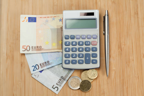 istock Money with pen and pocket calculator 825865724