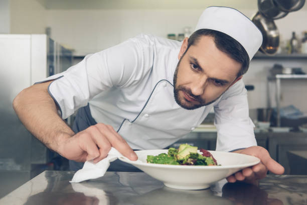 istock Man japanese restaurant chef cooking in the kitchen 825865804