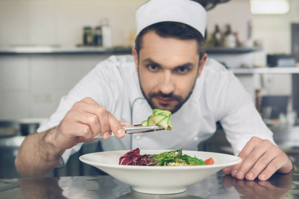 istock Man japanese restaurant chef cooking in the kitchen 825865834