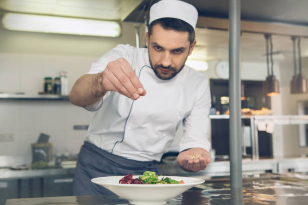 istock Man japanese restaurant chef cooking in the kitchen 825865886