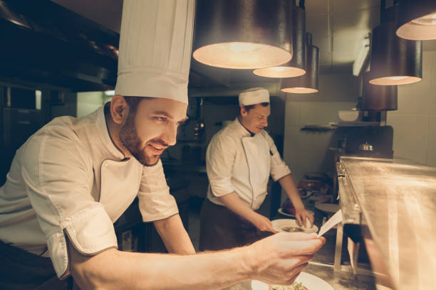 istock Man japanese restaurant chef cooking in the kitchen 825866628