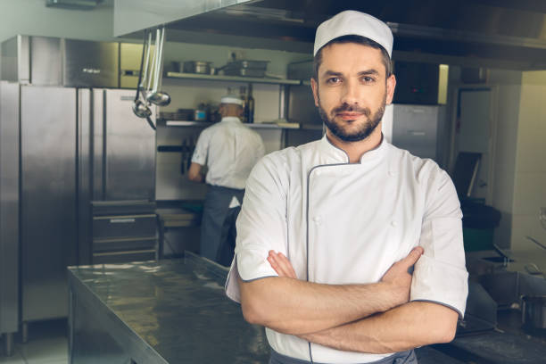 istock Man japanese restaurant chef cooking in the kitchen 825866732