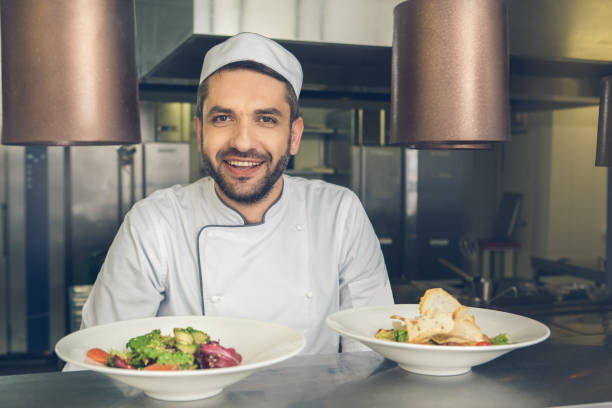 istock Man japanese restaurant chef cooking in the kitchen 825868968