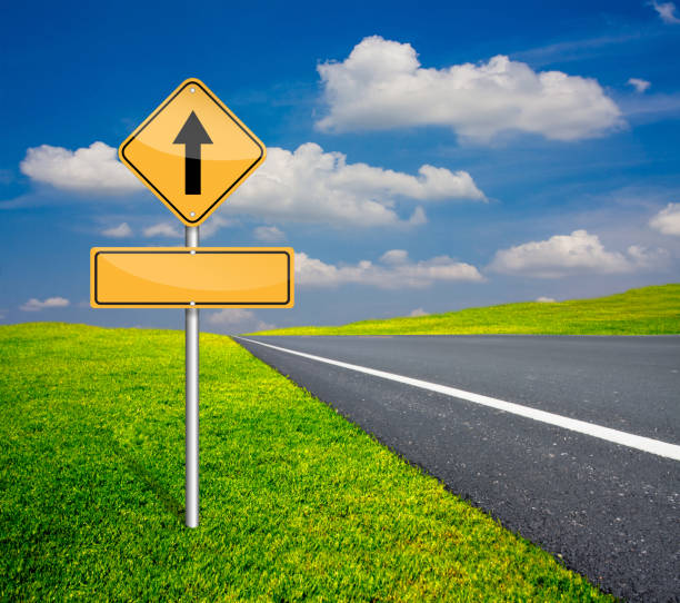 istock straight traffic beside asphalt road 825870114
