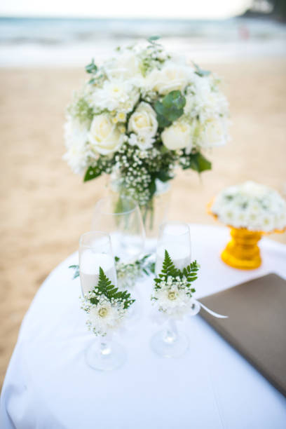 istock Soft focus Flowers decorate at a wedding ceremony on the beach. 825873594