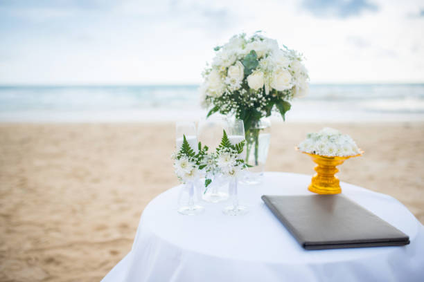 istock Soft focus Flowers decorate at a wedding ceremony on the beach. 825873652