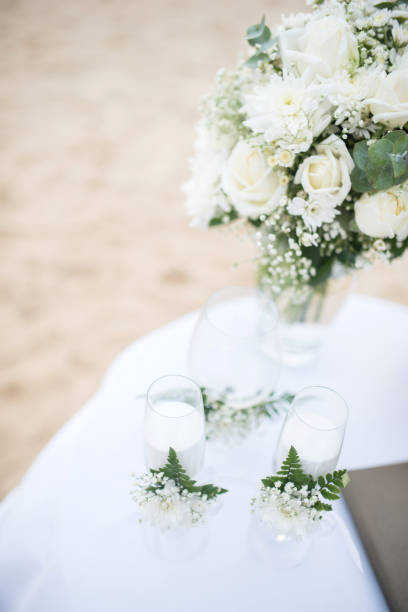 istock Soft focus Flowers decorate at a wedding ceremony on the beach. 825873682